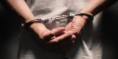 Hands in handcuffs