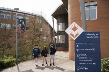 Three students outside the University