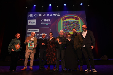 People accepting an award on stage