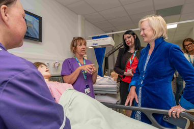 Women standing in a hospital ward