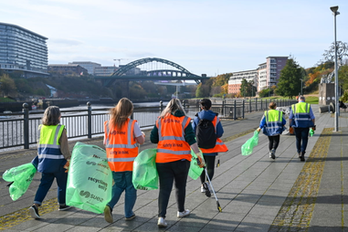 Staff and Students litter picking along riverside