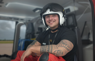 Man sitting inside a helicopter