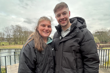 Two people standing