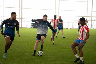 Football player kicking a ball