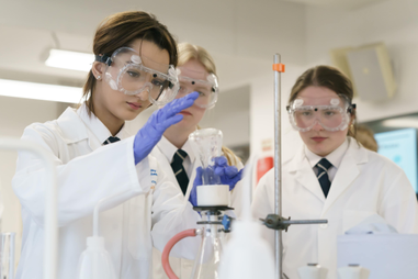 Students taking part in an experiment with beakers