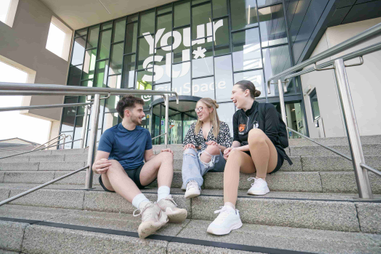 Three students sitting