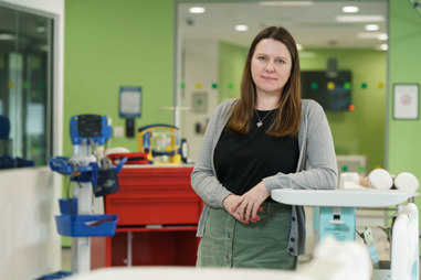 Woman standing in hospital ward