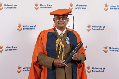 Honorary graduate in cap and gown