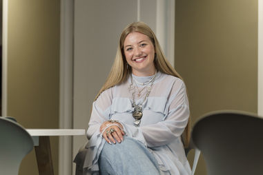 Graduate sat on chair