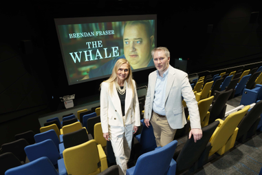 Academics stood in a cinema