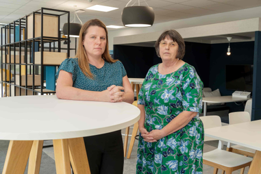 Dr Louise Harvey-Golding and Dr Diane Simpson standing together by a table