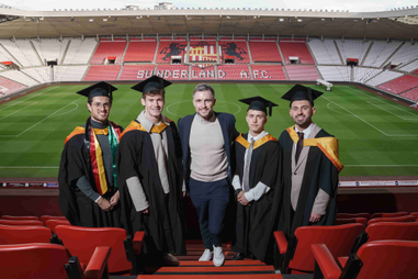 Students with academy head at the stadium of light
