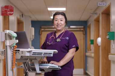 Nurse standing in hospital ward