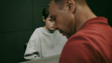 Man and boy sitting
