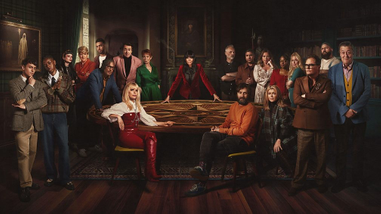 Group of famous people around a table