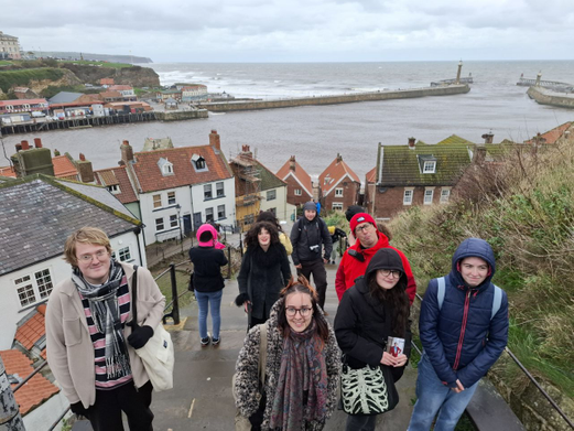 Group of people standing on steps