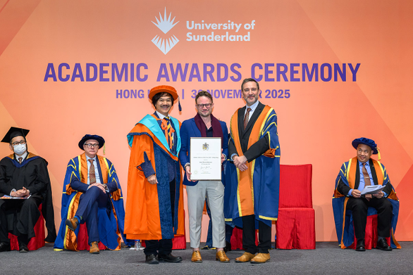 Three men standing on a stage