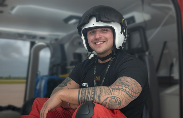 Man sitting inside a helicopter