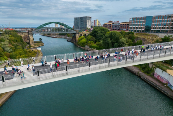 New footbridge with people walking on it