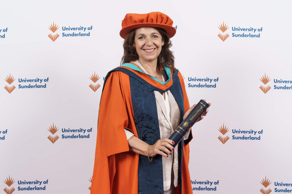 Honorary graduate in cap and gown