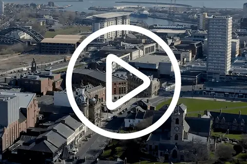 wide shot of sunderland city with play button icon