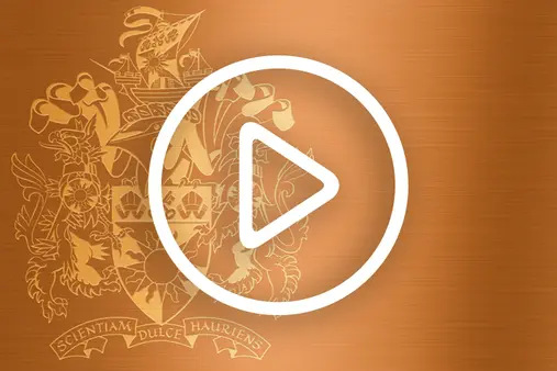 A play button for graduation videos, featuring the University of Sunderland crest 
