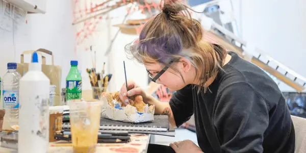 A fine art student working in the studio
