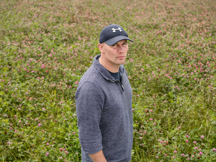 Farmer Stuart Johnson standing in one on of his fields