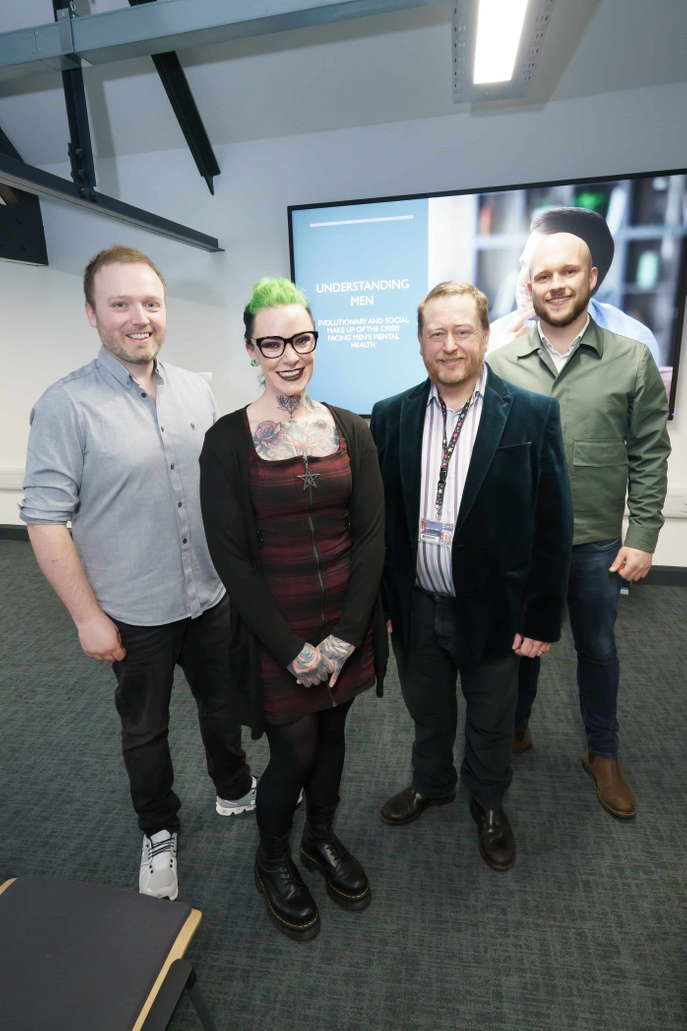 Four people standing