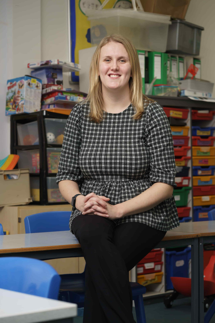 Woman sitting in classroom