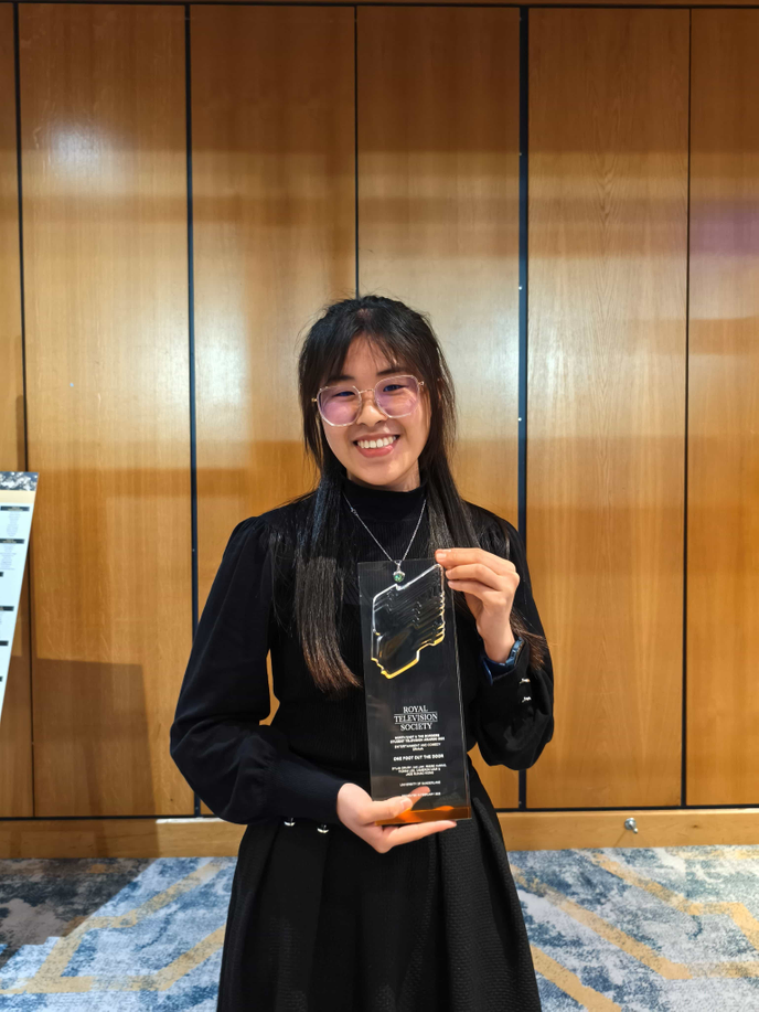 Woman holding an award