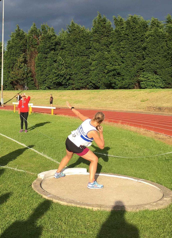 Woman throwing a shot put
