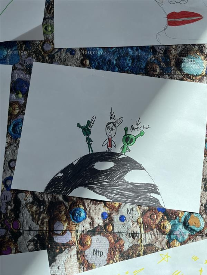 Picture of aliens making films that student drew