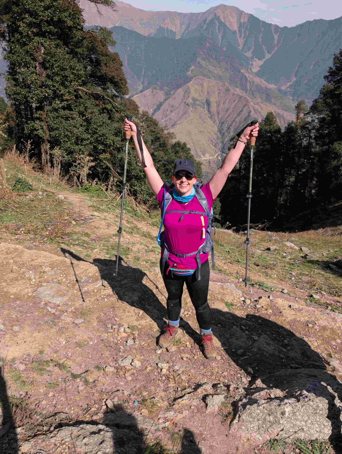 Lecturer celebrating wearing hiking gear
