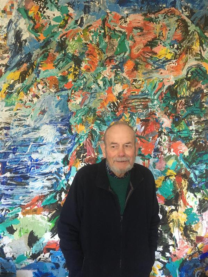 Man standing infront of artwork