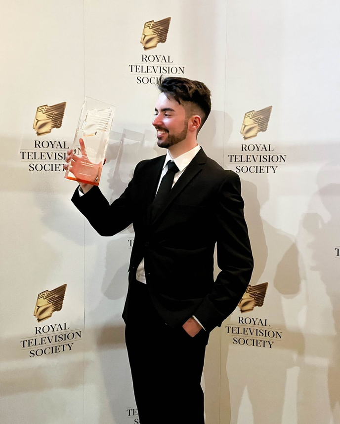 Tiago Francisco holding a Royal Television Society award