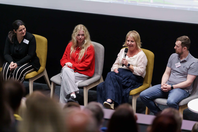 Chancellor with guests speaking on a panel