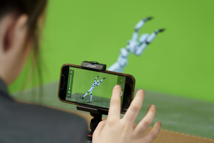 Motion capture of a model shown through a phone