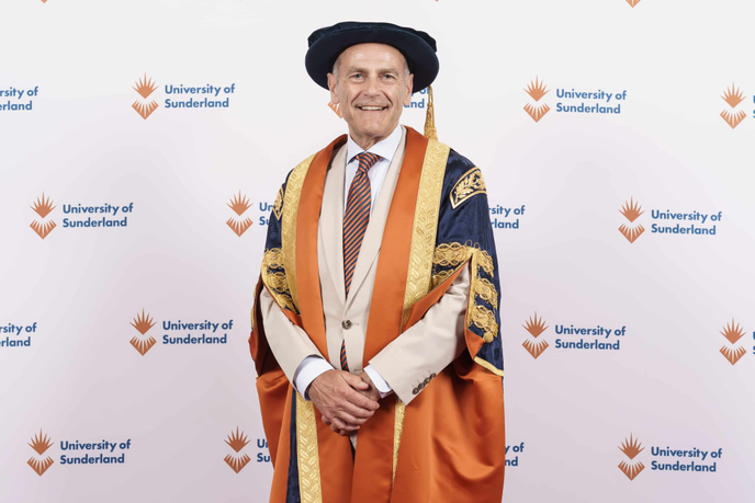 Pro-chancellor Jeff Brown in cap and gown