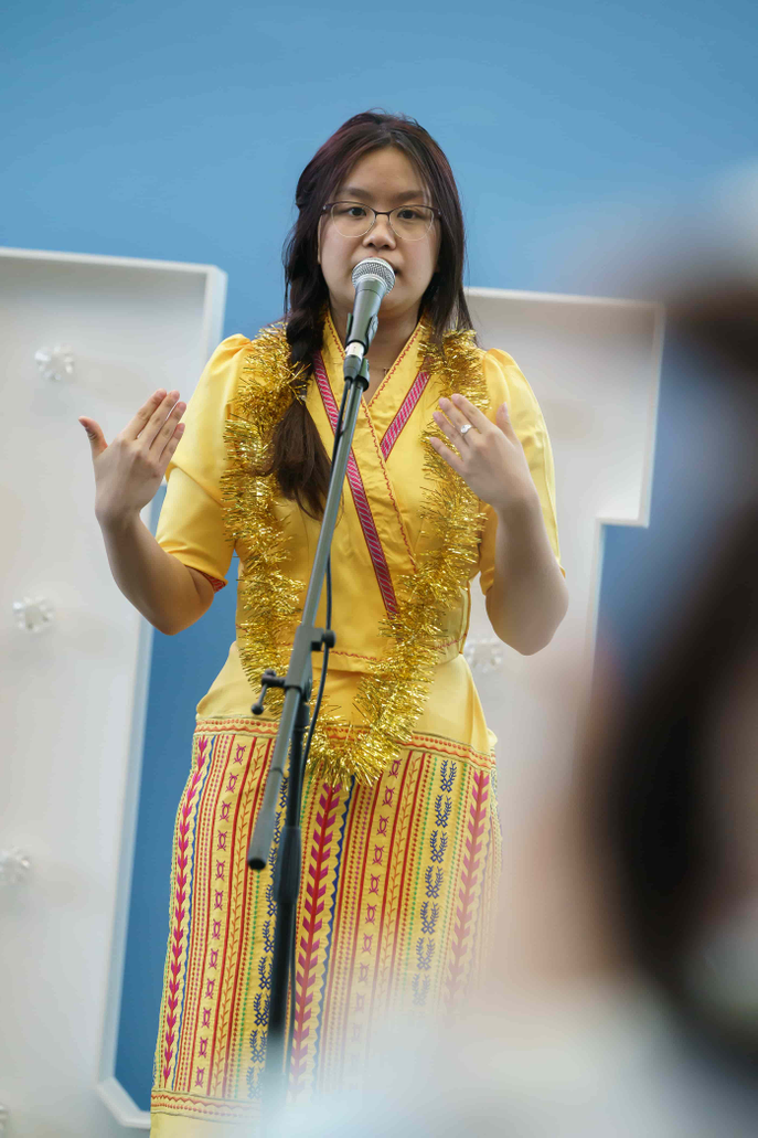 Student speaking with microphone