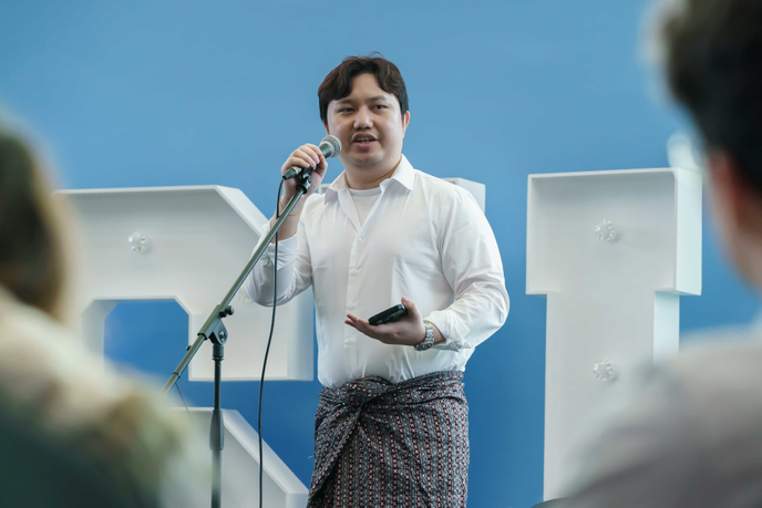 Student speaking with microphone