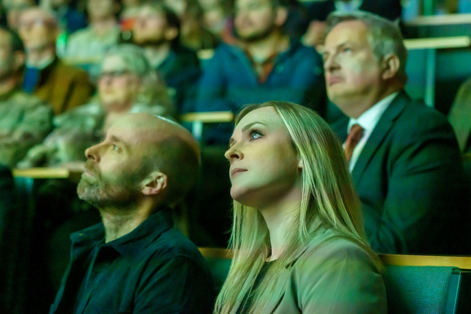 Academics watching a screen