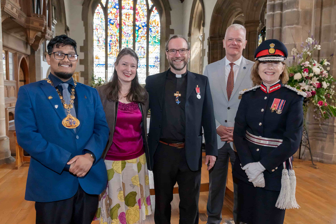 Reverend Chris Howson receiving his British Empire Medal