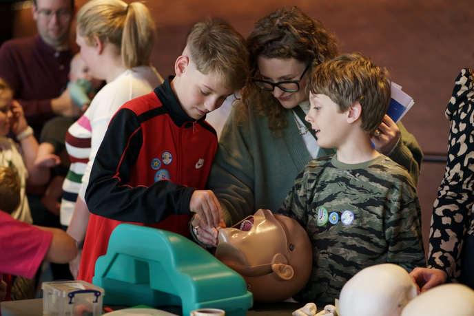 Children exploring model teeth