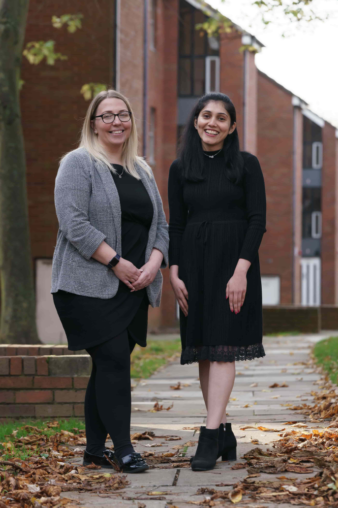 Two women standing