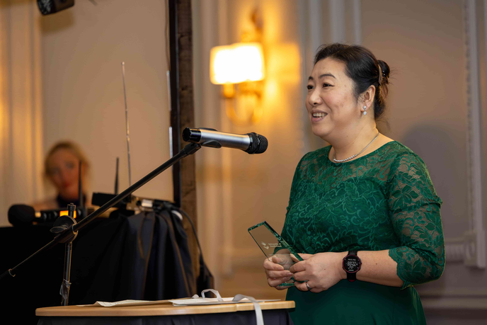Woman holding an award