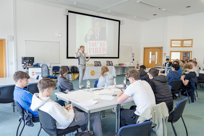 Apprentice star Adam Corbally presenting to students at the University of Sunderland's Business Boardroom Battle