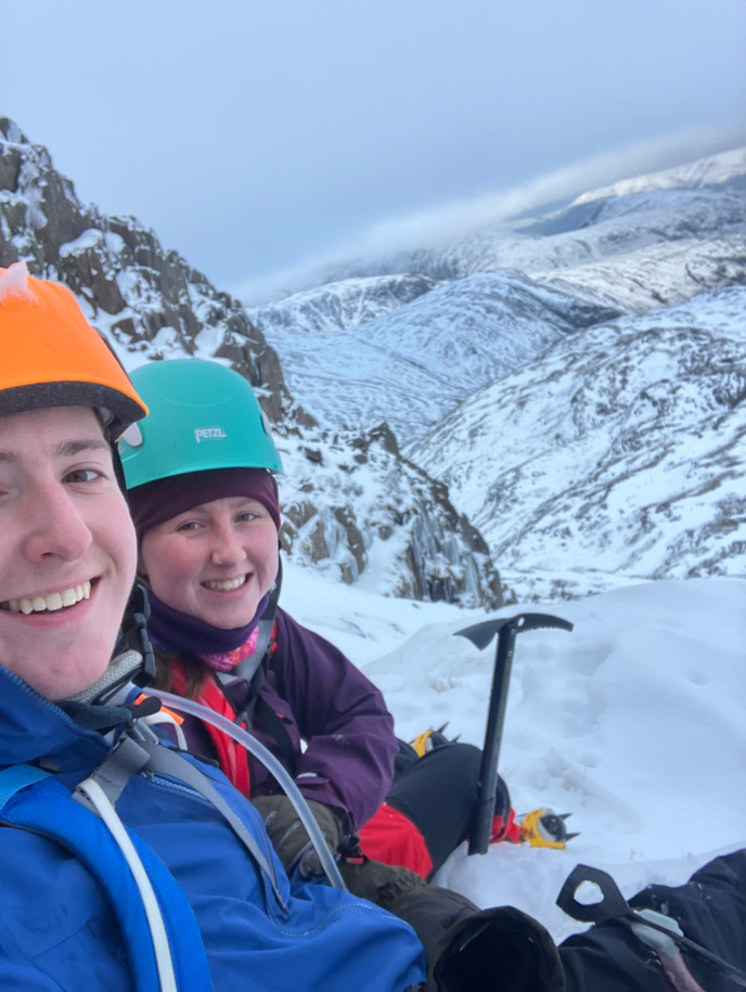 Student with partner in snowy mountains