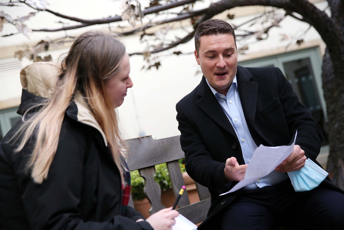 Graduate interviewing government minister