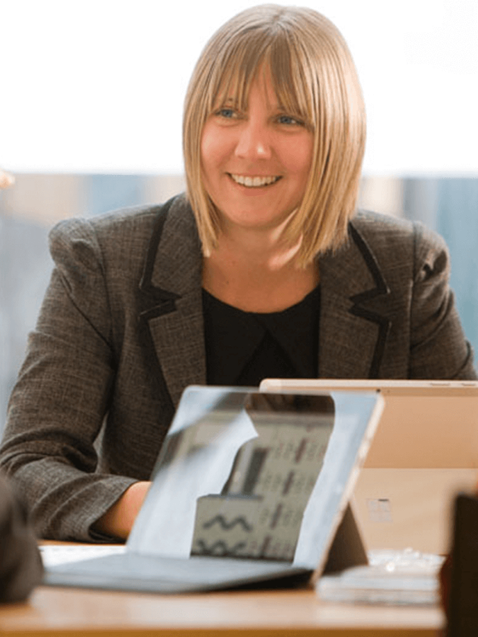 Woman sitting and smiling